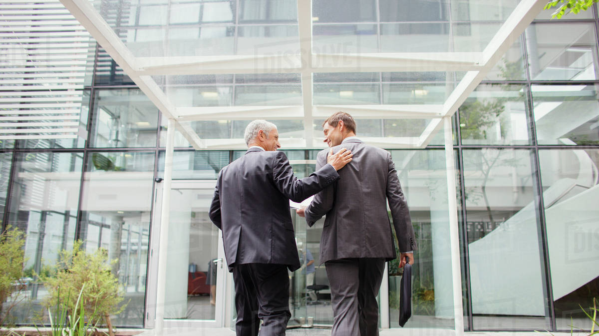 Two business men walking into glass building. Rated Best Filing Services reviewed for Florida Filing. Cost-effective, quick, in house filing for all your court service needs. Located infront of Miami